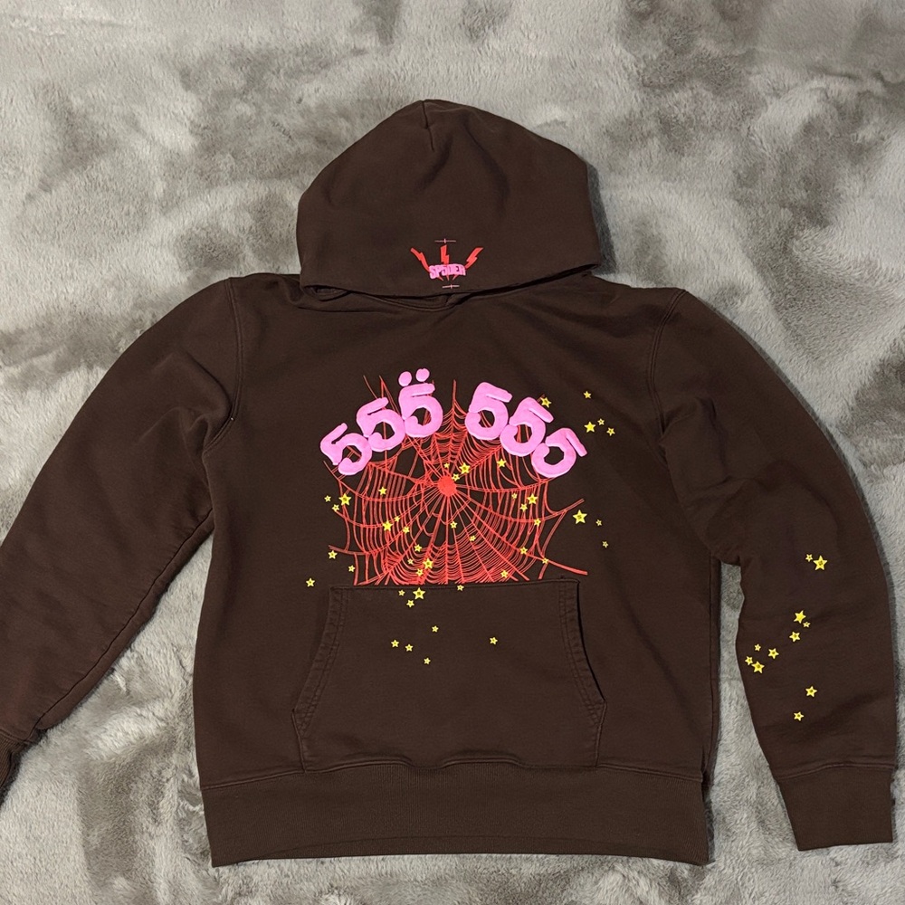Spider hoodie colours being pink,red, brown, and yellow stars (real)